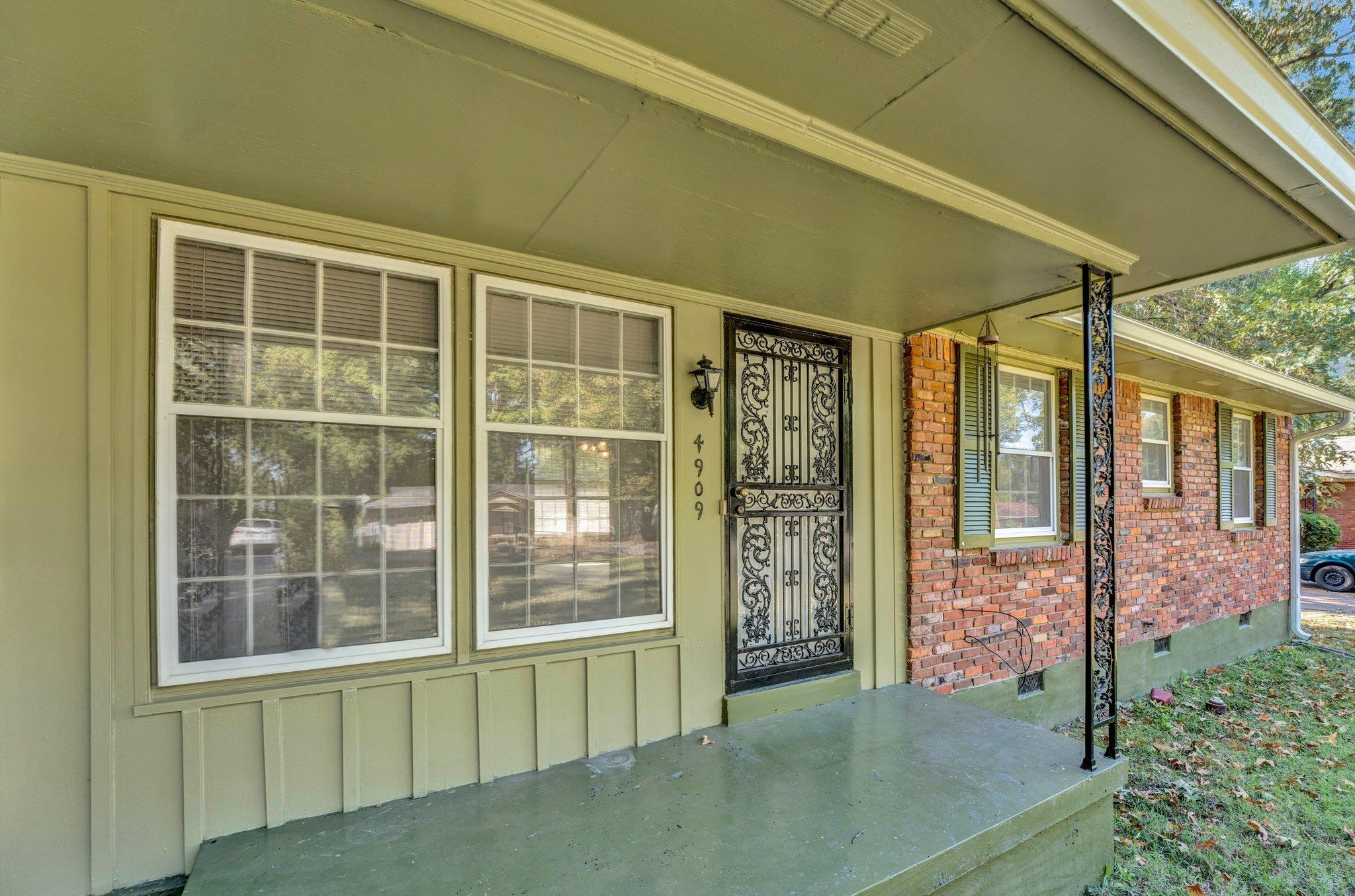 4909 Lochinvar Road Memphis, TN 38116 - Photo 2 of 21 Front porch and entrance with storm door.