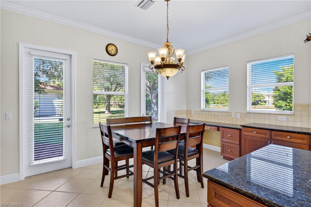 2212 Vardin Place Naples, FL 34120 - Photo 14 of 50 a view of a dining room with furniture window and outside view