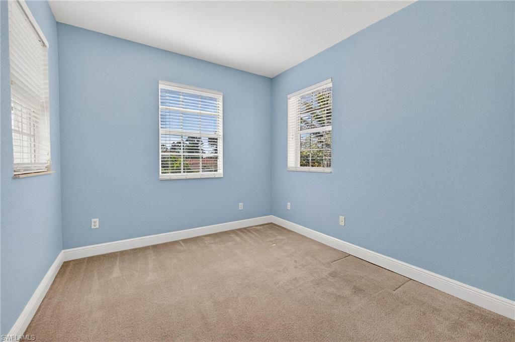 2212 Vardin Place Naples, FL 34120 - Photo 24 of 50 an empty room with windows