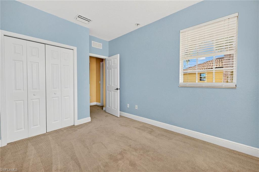 2212 Vardin Place Naples, FL 34120 - Photo 25 of 50 a view of an empty room with a window