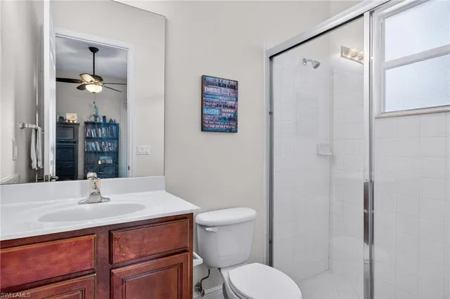 a bathroom with a sink toilet tub and shower