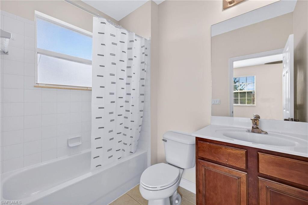 2212 Vardin Place Naples, FL 34120 - Photo 30 of 50 a bathroom with a sink toilet tub and shower