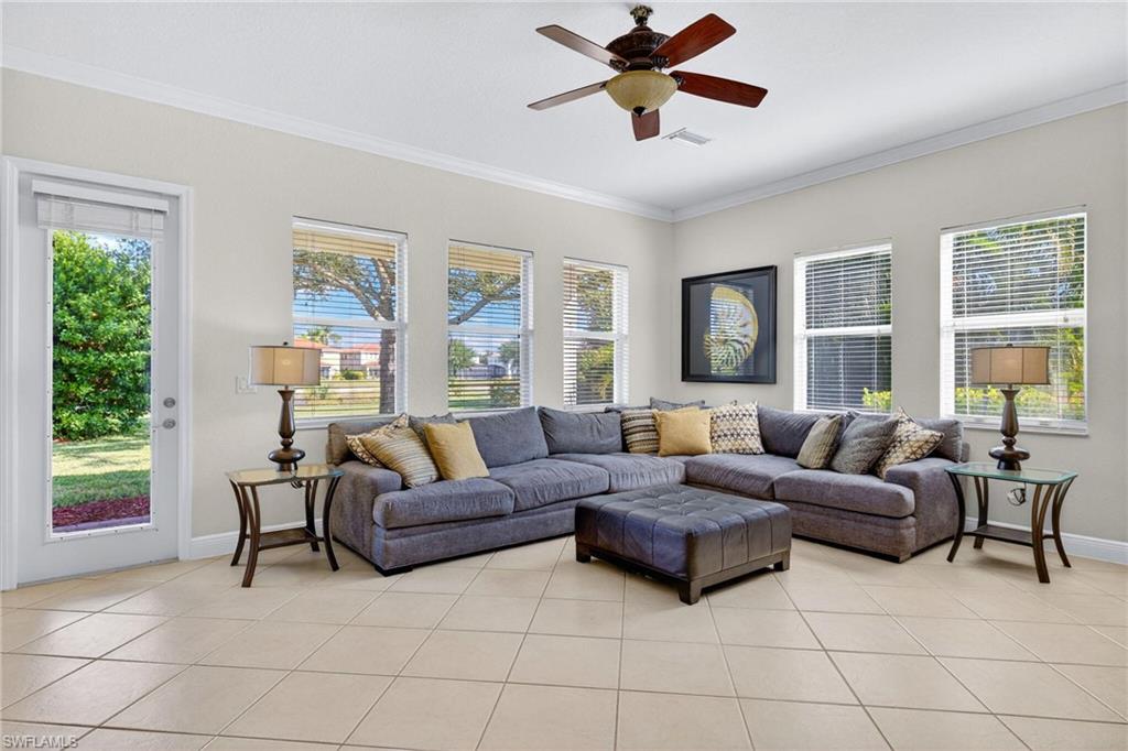 2212 Vardin Place Naples, FL 34120 - Photo 3 of 50 a living room with furniture and a large window