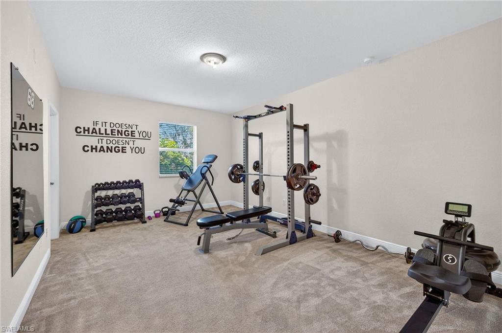 2212 Vardin Place Naples, FL 34120 - Photo 34 of 50 a view of a room with gym equipment