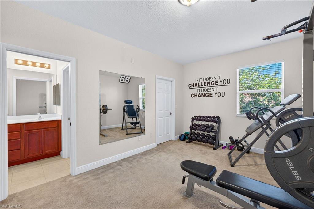 2212 Vardin Place Naples, FL 34120 - Photo 35 of 50 a room with furniture and window