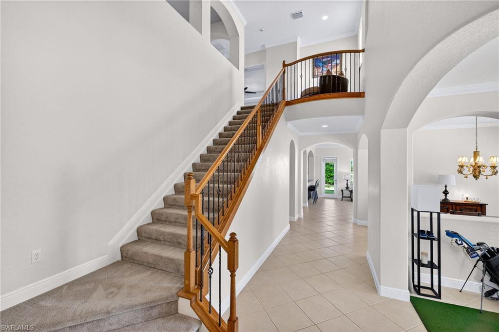 2212 Vardin Place Naples, FL 34120 - Photo 36 of 50 a view of entryway and hall with wooden floor