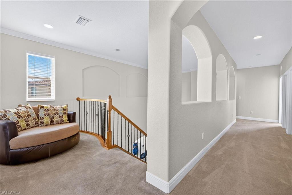 2212 Vardin Place Naples, FL 34120 - Photo 37 of 50 a living room with furniture and a window