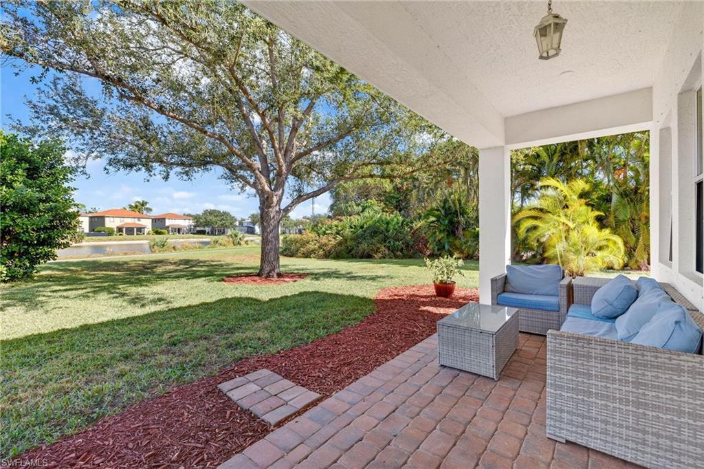2212 Vardin Place Naples, FL 34120 - Photo 39 of 50 a outdoor living space with furniture and garden