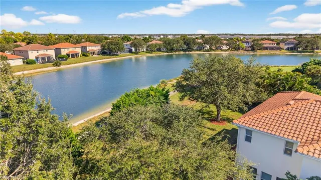 an aerial view of a house with a swimming pool