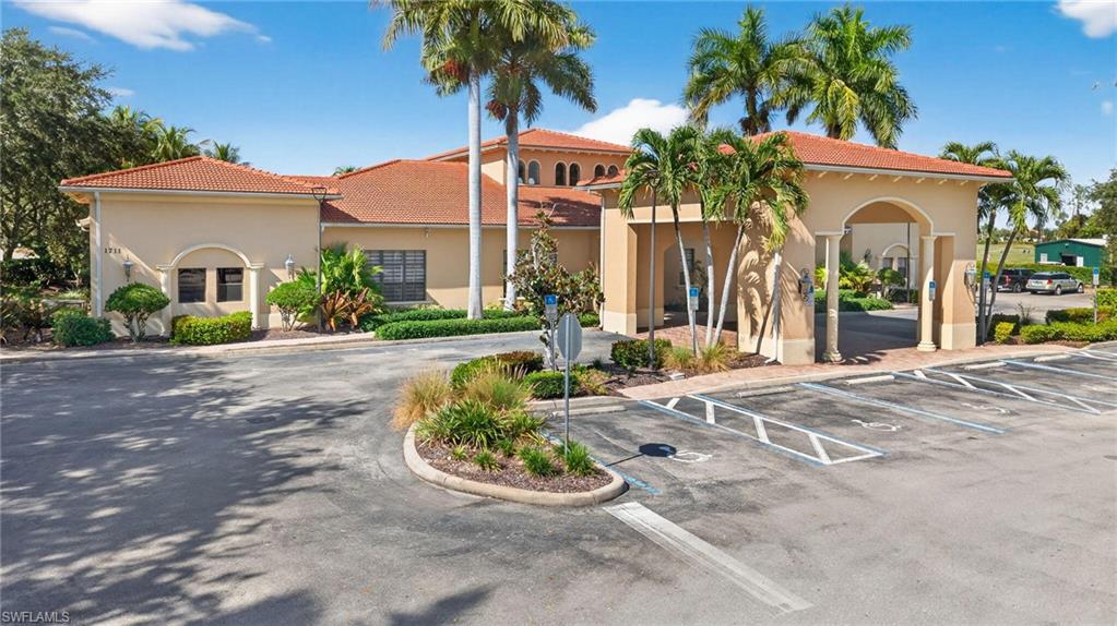 2212 Vardin Place Naples, FL 34120 - Photo 47 of 50 a front view of a house with garden