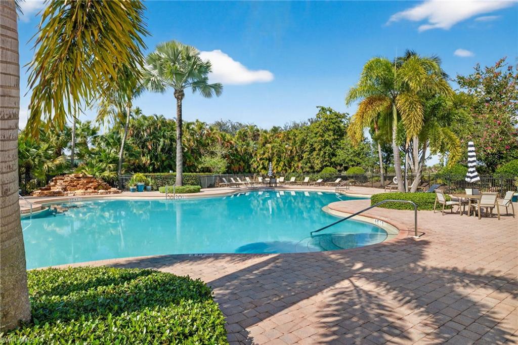 2212 Vardin Place Naples, FL 34120 - Photo 50 of 50 a view of a lake with a palm trees