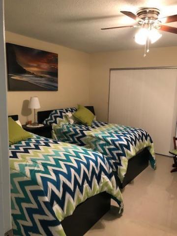 3300 Springdale Boulevard, Unit 301 Palm Springs, FL 33461 - Photo 2 of 9 guess bedroom