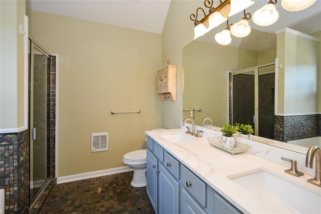 10 Arbor Hills Road South Talking Rock, GA 30175 - Photo 37 of 89 a bathroom with a granite countertop sink and a mirror