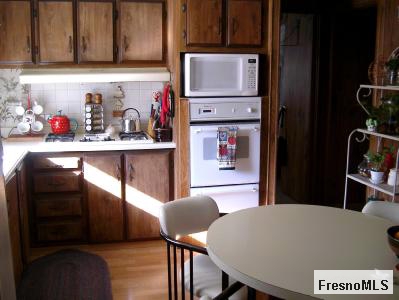 16035 Morgan Canyon Road Prather, CA 93651 - Photo 6 of 6 KITCHEN WITH LAMINATE FLOORING