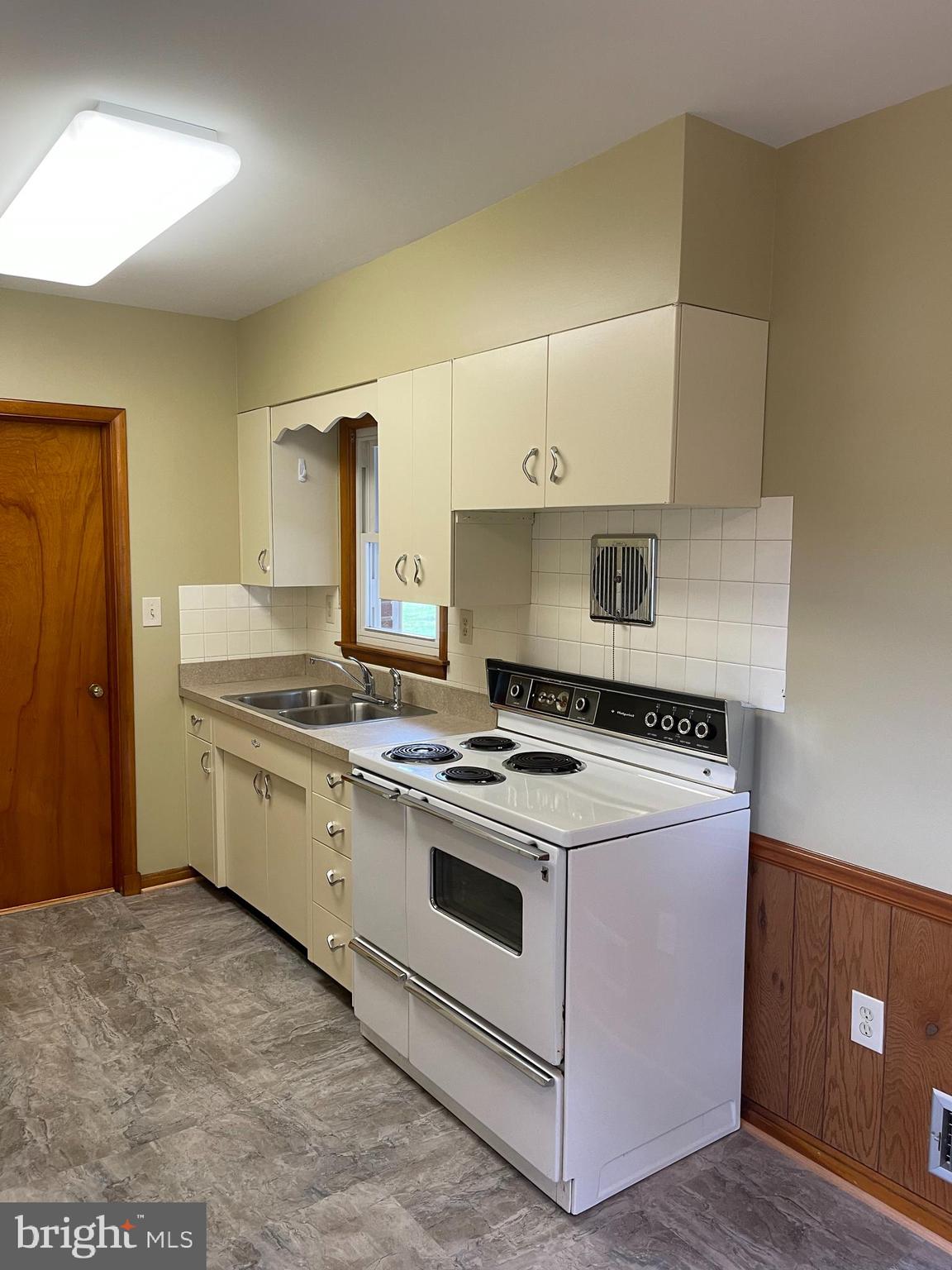 1670 Florence Road Mount Airy, MD 21771 - Photo 11 of 20 a kitchen with a stove top oven and cabinets