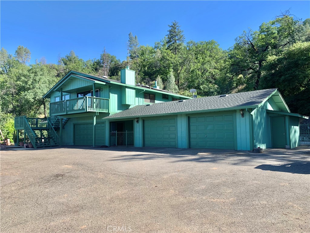 18683 Morgan Valley Road Lower Lake, CA 95457 - Photo 2 of 16 a front view of a house with a yard and trees