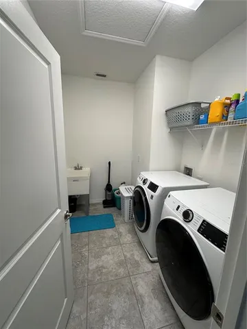 a utility room with dryer and washer