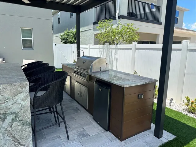 a outdoor dining space with furniture