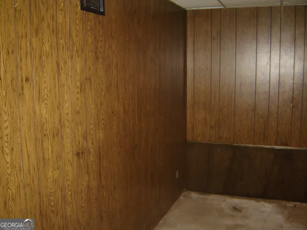 a view of a room with wooden walls