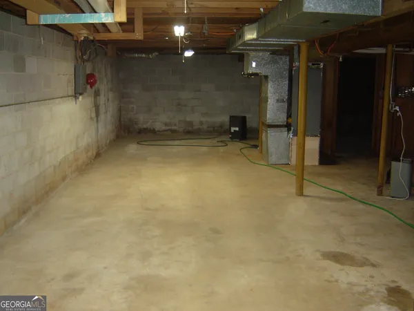 a room with gym equipment and a flat screen tv