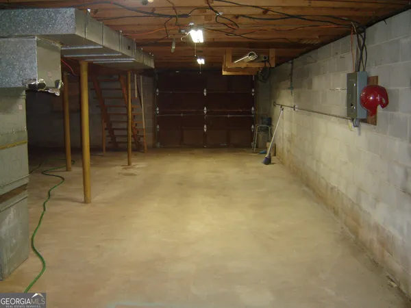 a room with water heater and wooden door