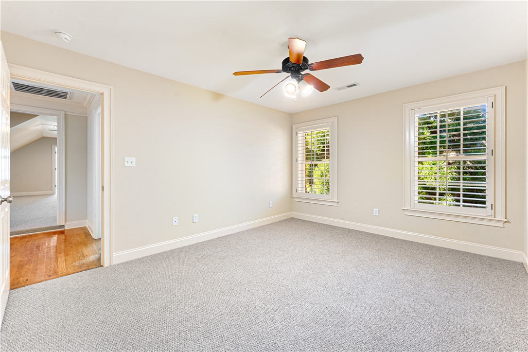 109 Limelight Drive Anderson, SC 29621 - Photo 25 of 34 This spacious bedroom offers ample natural light and plush carpeting, perfect for peaceful living.