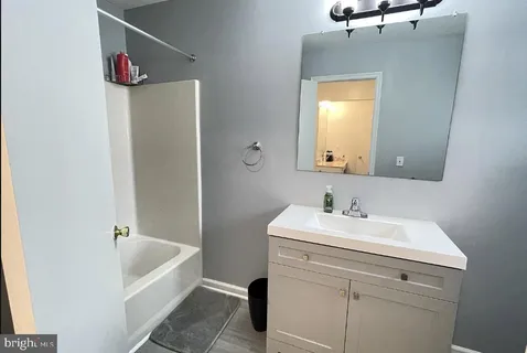 a bathroom with a sink and a bathtub