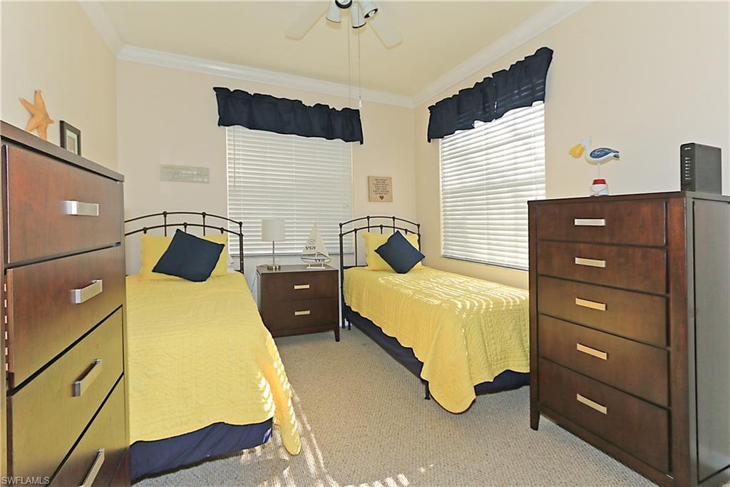 4670 St Croix Lane, Unit 618 Naples, FL 34109 - Photo 14 of 19 a bedroom with a bed and lamp