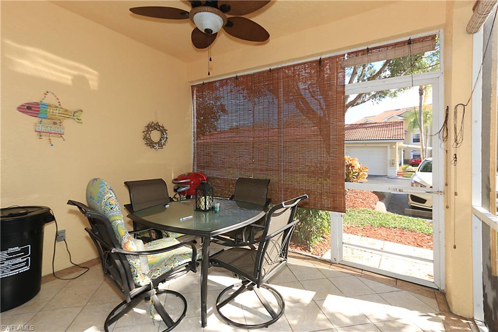 4670 St Croix Lane, Unit 618 Naples, FL 34109 - Photo 16 of 19 a view of a dining room with furniture window and outside view