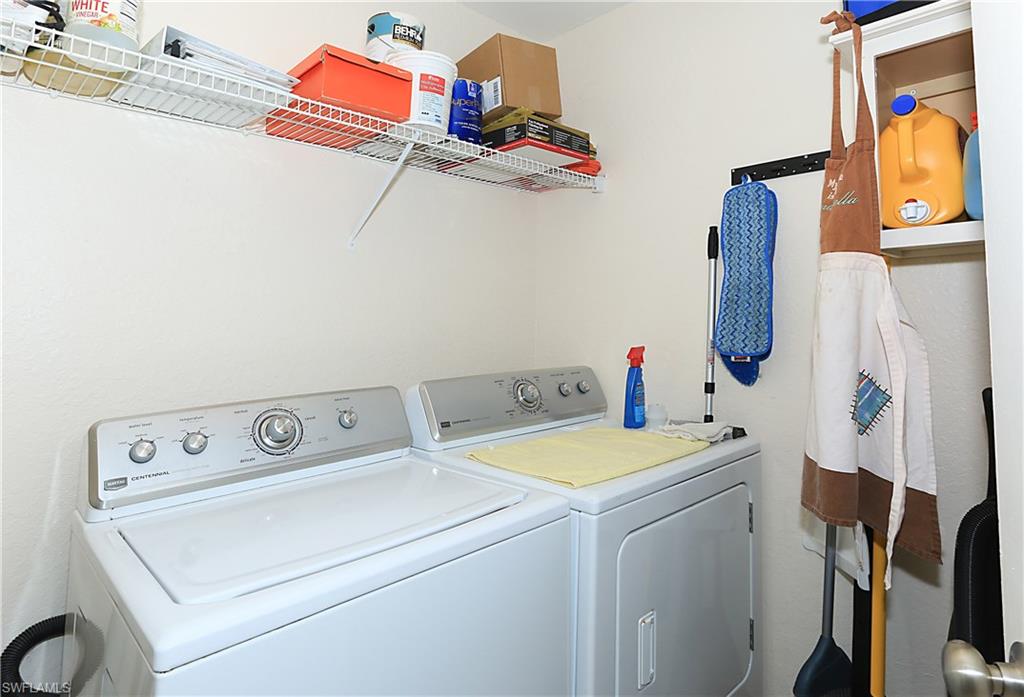 4670 St Croix Lane, Unit 618 Naples, FL 34109 - Photo 17 of 19 a utility room with dryer and washer