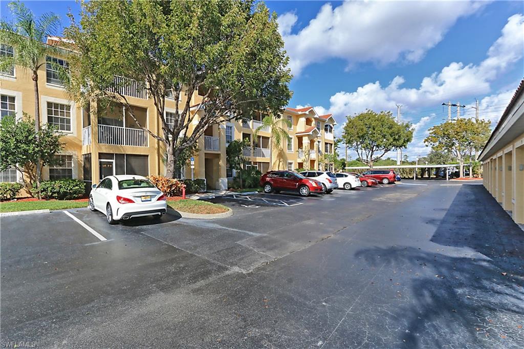 4670 St Croix Lane, Unit 618 Naples, FL 34109 - Photo 18 of 19 a car parked in front of a building