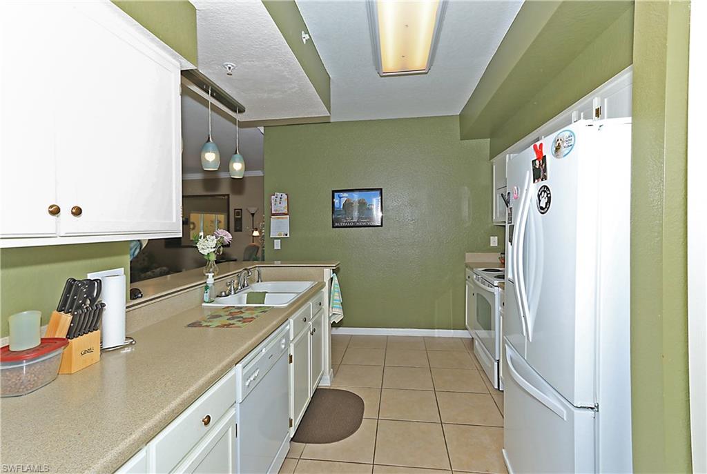 4670 St Croix Lane, Unit 618 Naples, FL 34109 - Photo 3 of 19 a bathroom with a sink a toilet and a bathtub