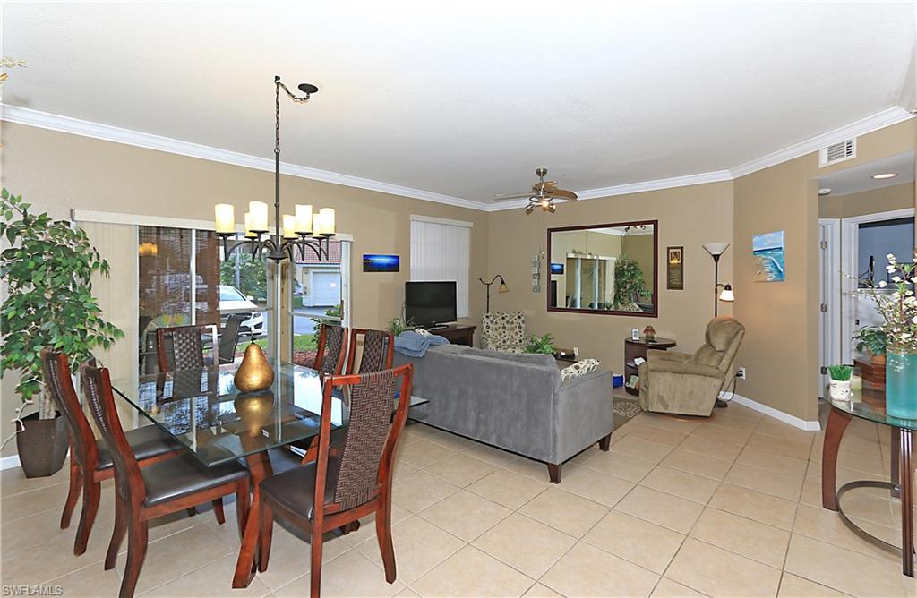 4670 St Croix Lane, Unit 618 Naples, FL 34109 - Photo 8 of 19 a view of a livingroom with furniture and window