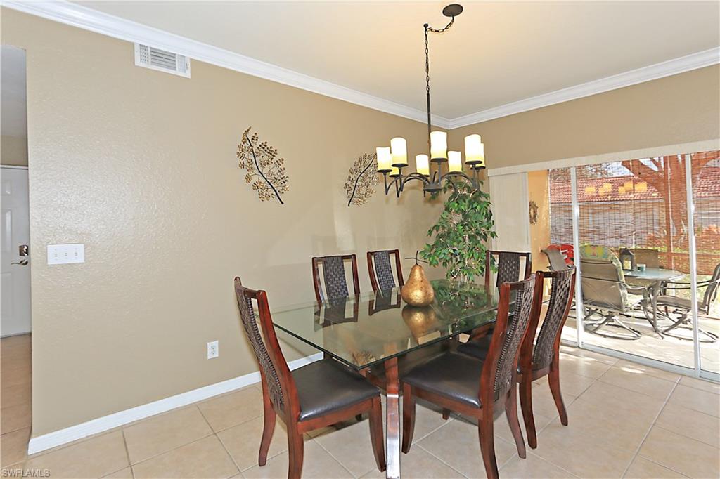 4670 St Croix Lane, Unit 618 Naples, FL 34109 - Photo 10 of 19 a view of a dining room with furniture window and outside view
