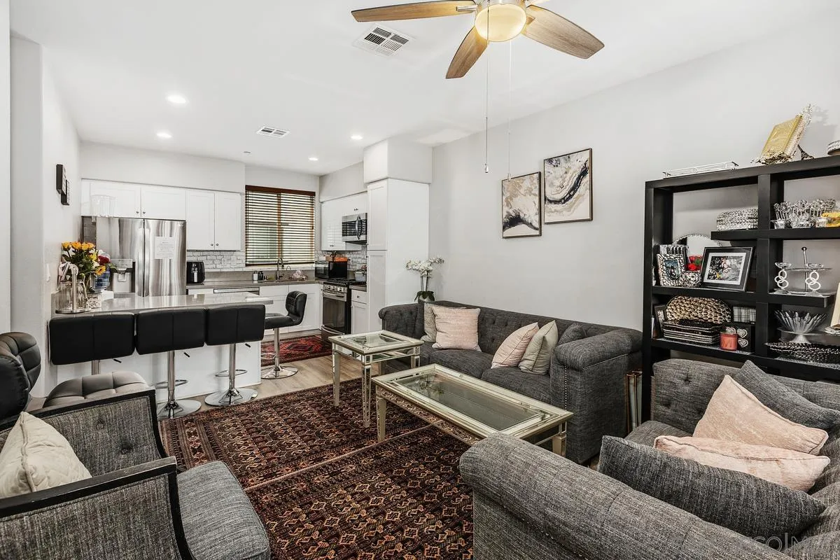 a living room with furniture and a rug