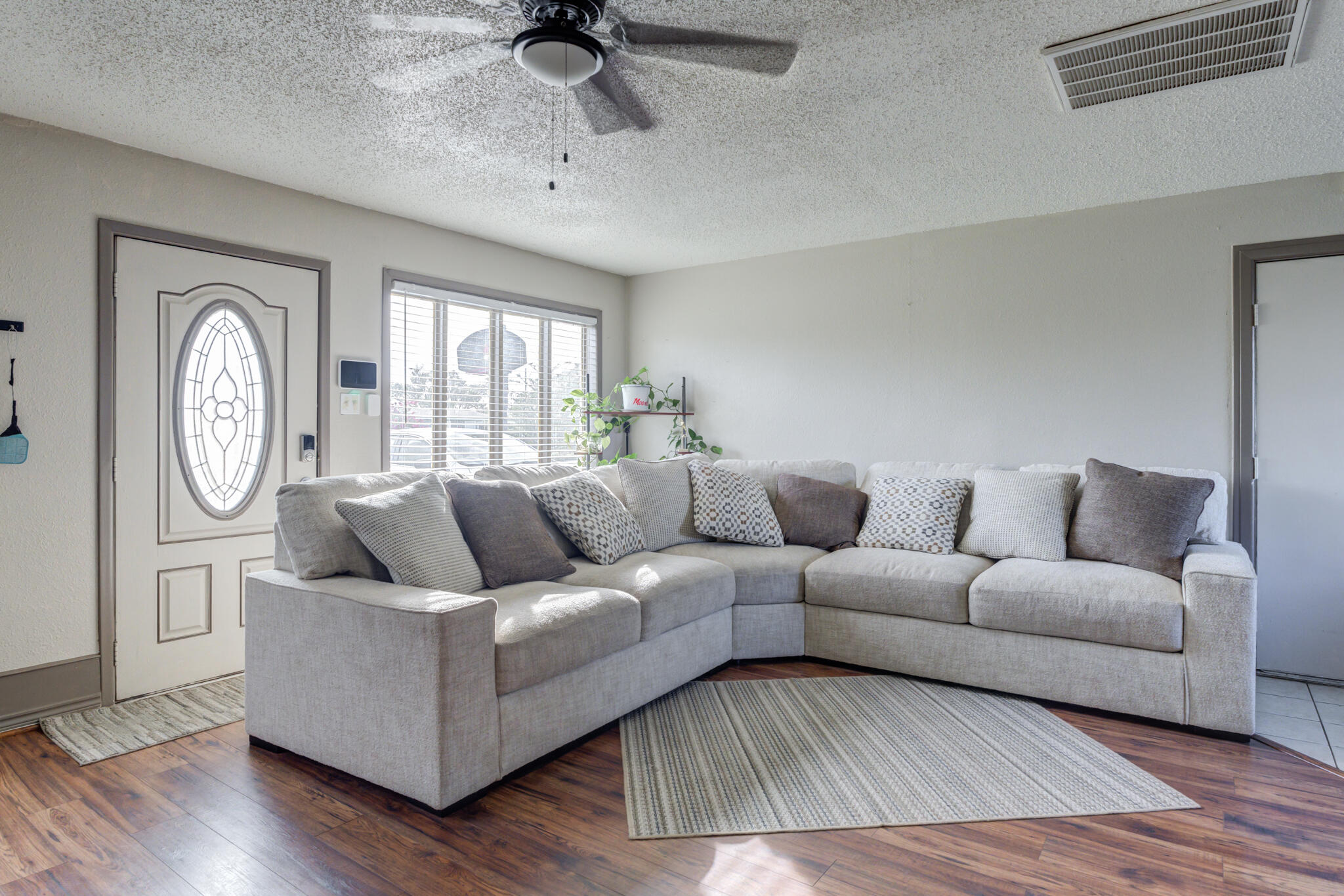 2901 Beech Avenue Lubbock, TX 79404 - Photo 2 of 26 a living room with furniture and a large window