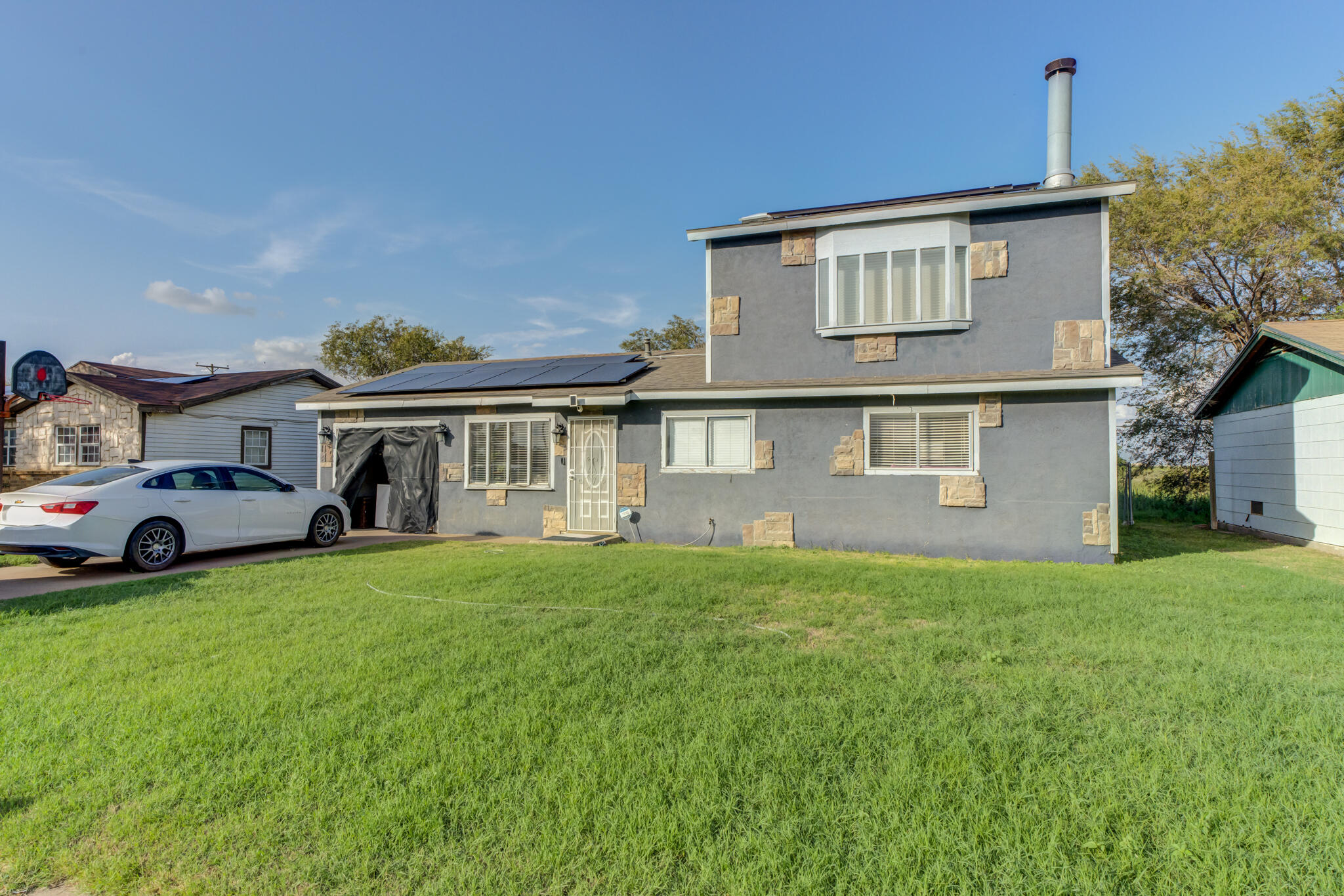2901 Beech Avenue Lubbock, TX 79404 - Photo 7 of 26 a front view of a house with a garden