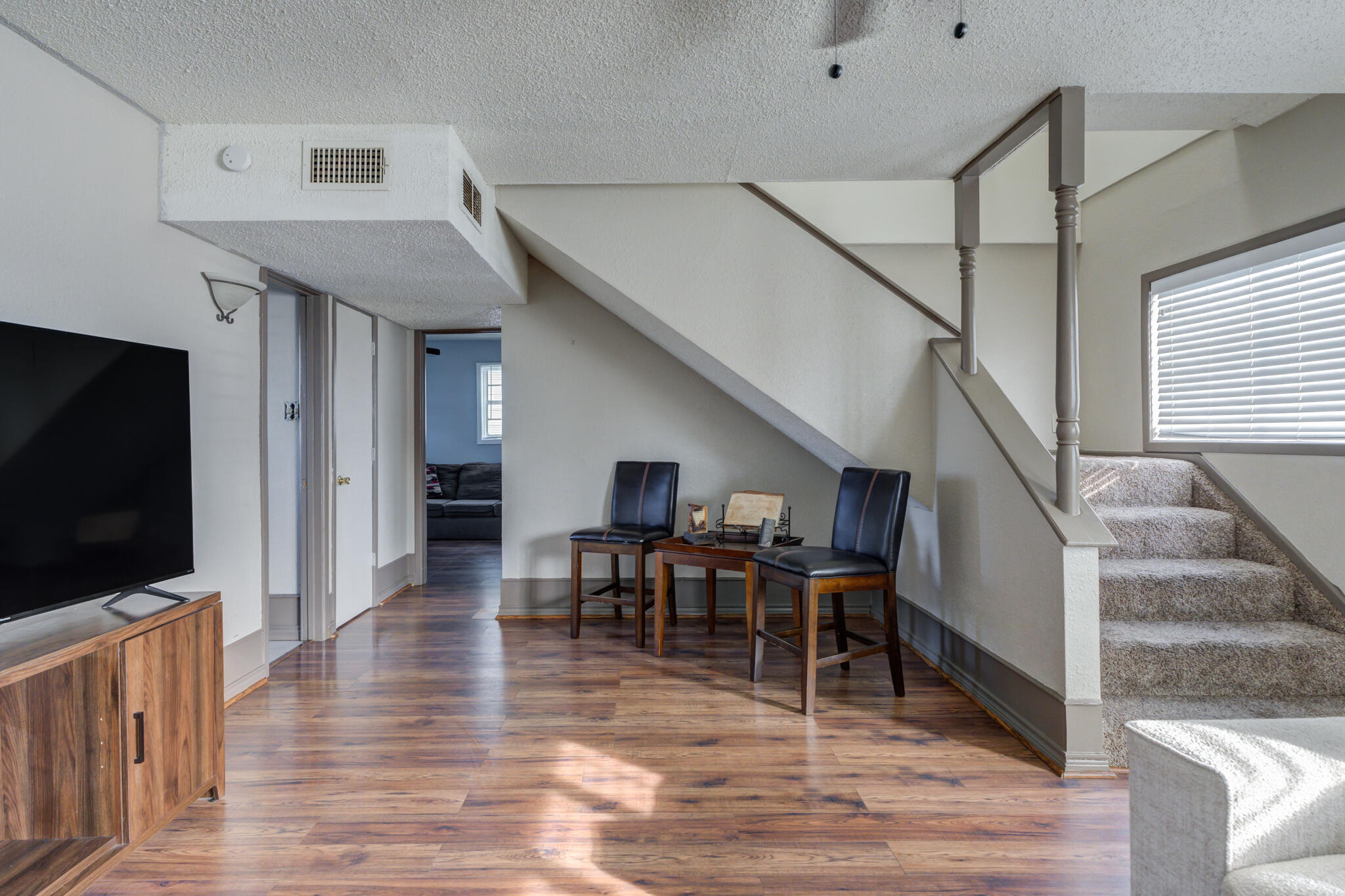 2901 Beech Avenue Lubbock, TX 79404 - Photo 10 of 26 a view of a livingroom with furniture and wooden floor