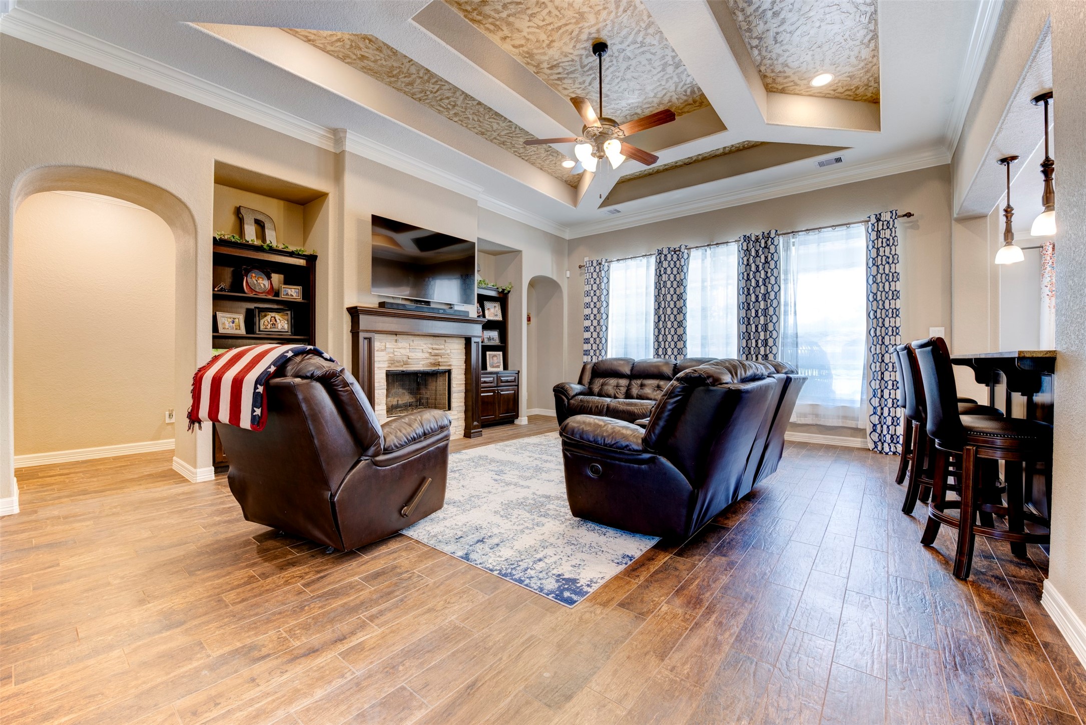 27635 Rio Blanco Drive Splendora, TX 77372 - Photo 11 of 46 a living room with furniture flat screen tv and fireplace
