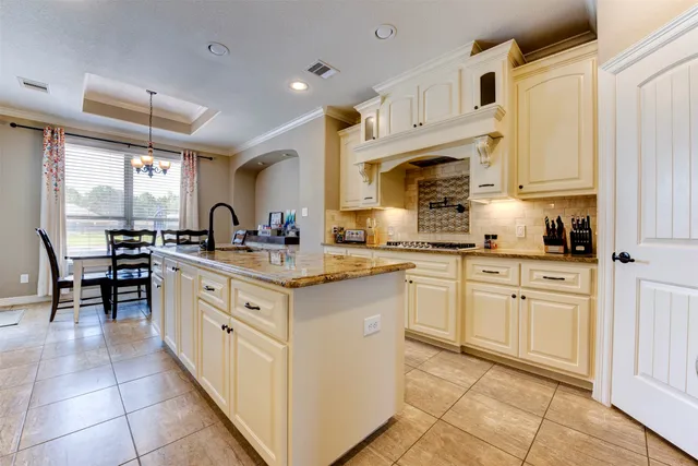 a kitchen with cabinets appliances and a counter top space