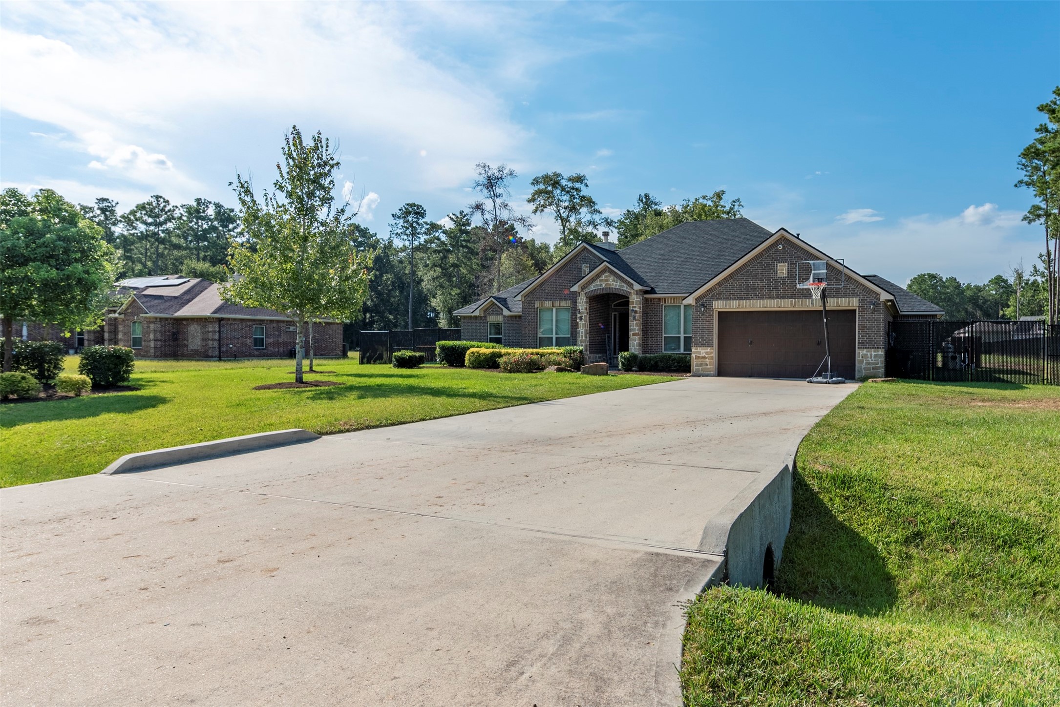 27635 Rio Blanco Drive Splendora, TX 77372 - Photo 2 of 46 a front view of a house with garden