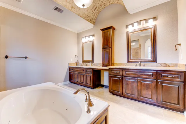 a bathroom with a bathtub and a sink