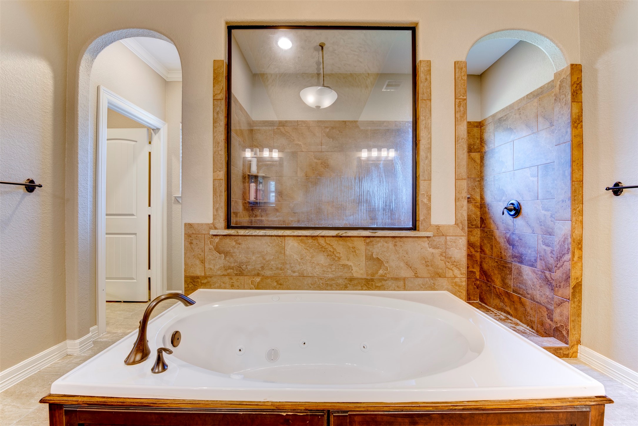 27635 Rio Blanco Drive Splendora, TX 77372 - Photo 29 of 46 a bathroom with a tub and shower