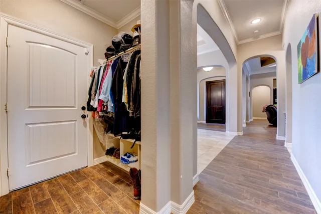 a bathroom with a toilet sink vanity and mirror