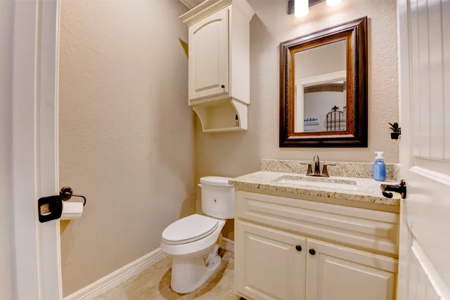 a kitchen with stainless steel appliances granite countertop a refrigerator and a stove