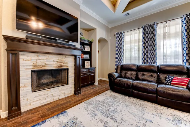 a living room with furniture and a fireplace