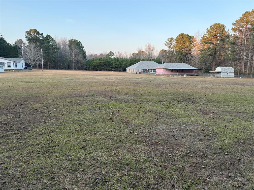 561 Wells Road Haughton, LA 71037 - Photo 21 of 21 a view of a field with trees in the background