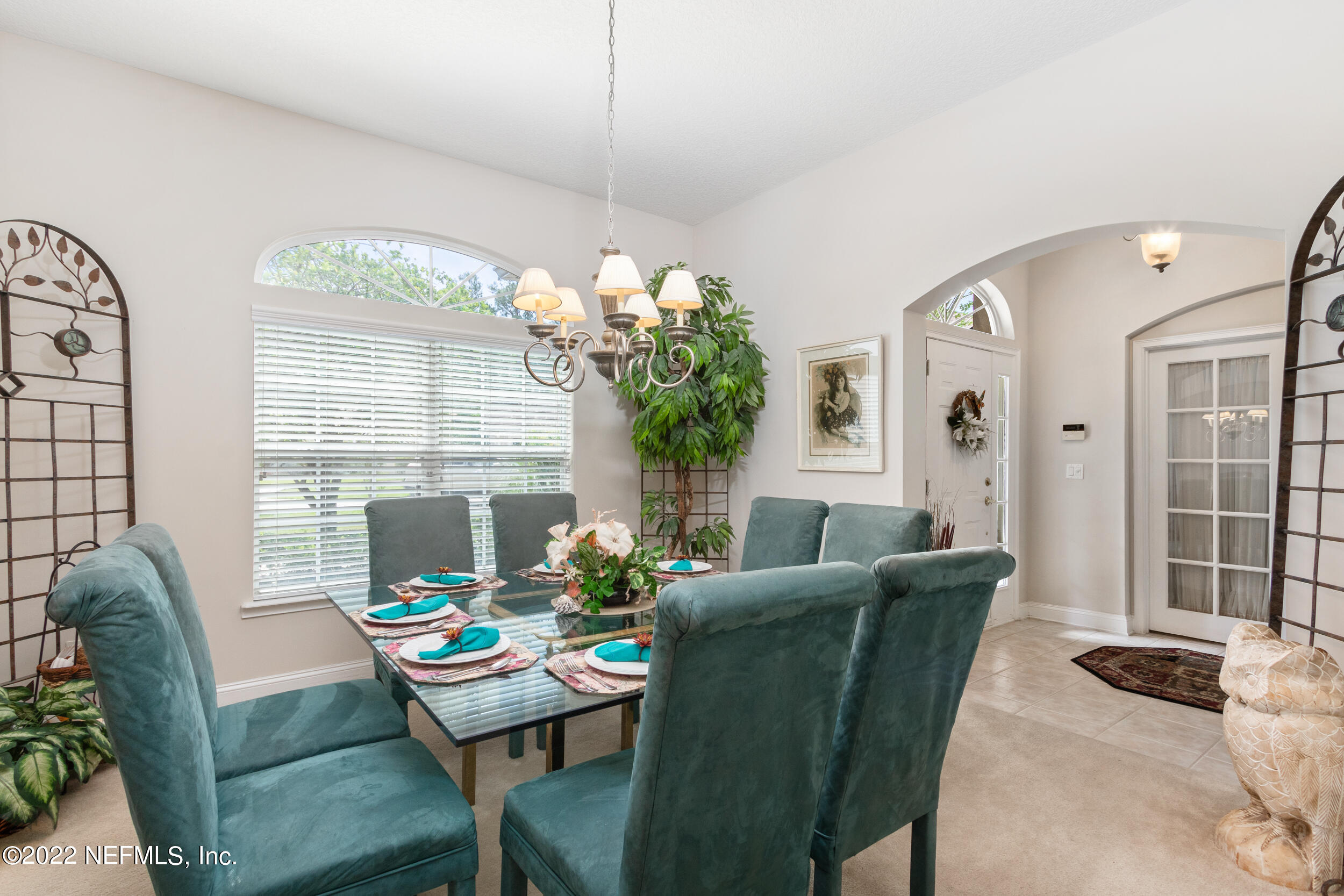 1304 Paradise Pond Road St. Augustine, FL 32092 - Photo 13 of 48 a living room with furniture potted plant and a large window
