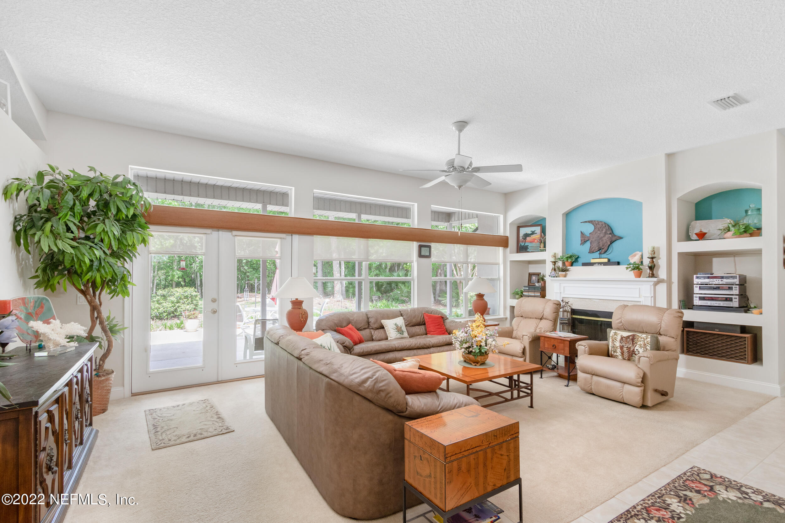 1304 Paradise Pond Road St. Augustine, FL 32092 - Photo 18 of 48 a living room with furniture and a large window