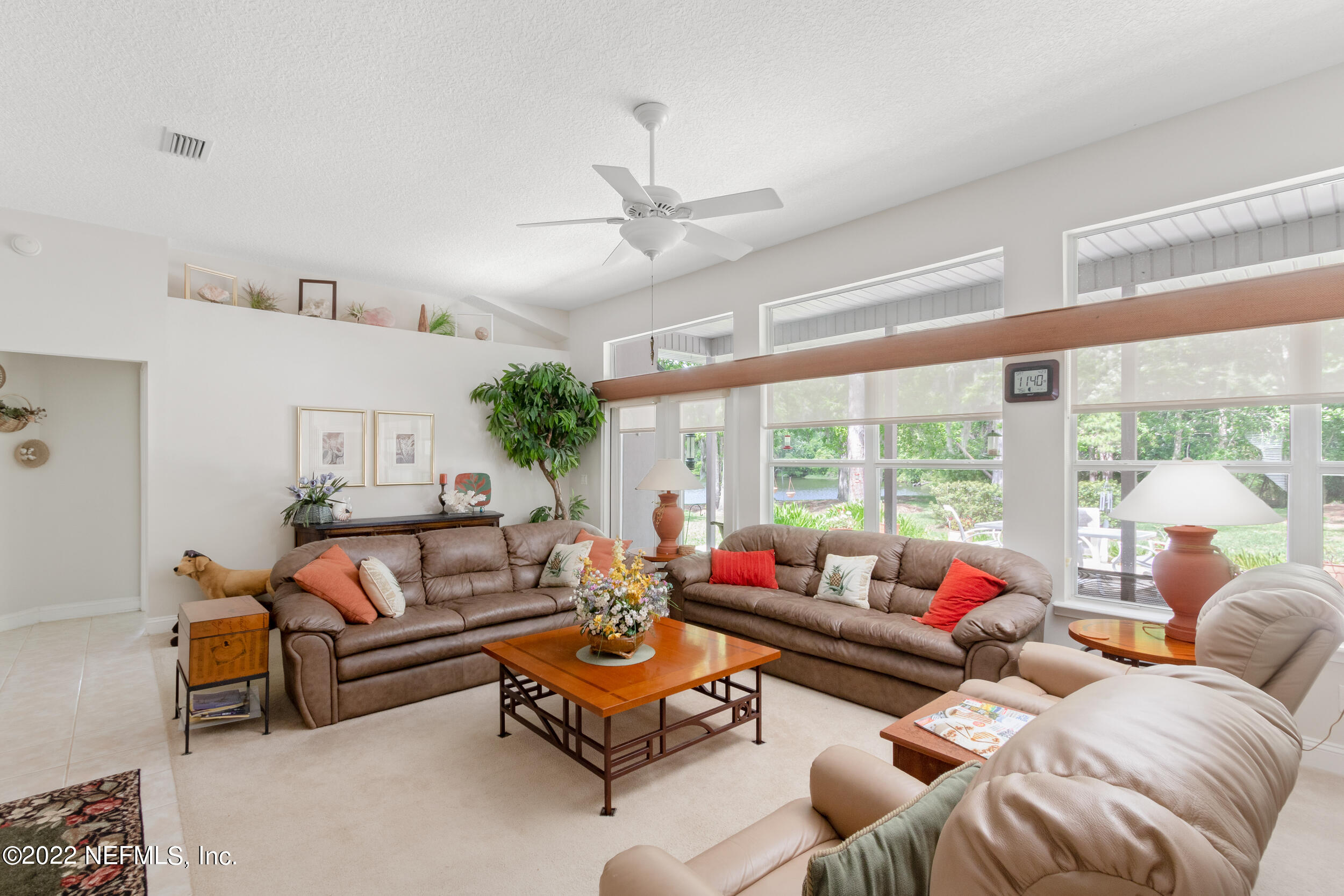 1304 Paradise Pond Road St. Augustine, FL 32092 - Photo 19 of 48 a living room with furniture and a large window